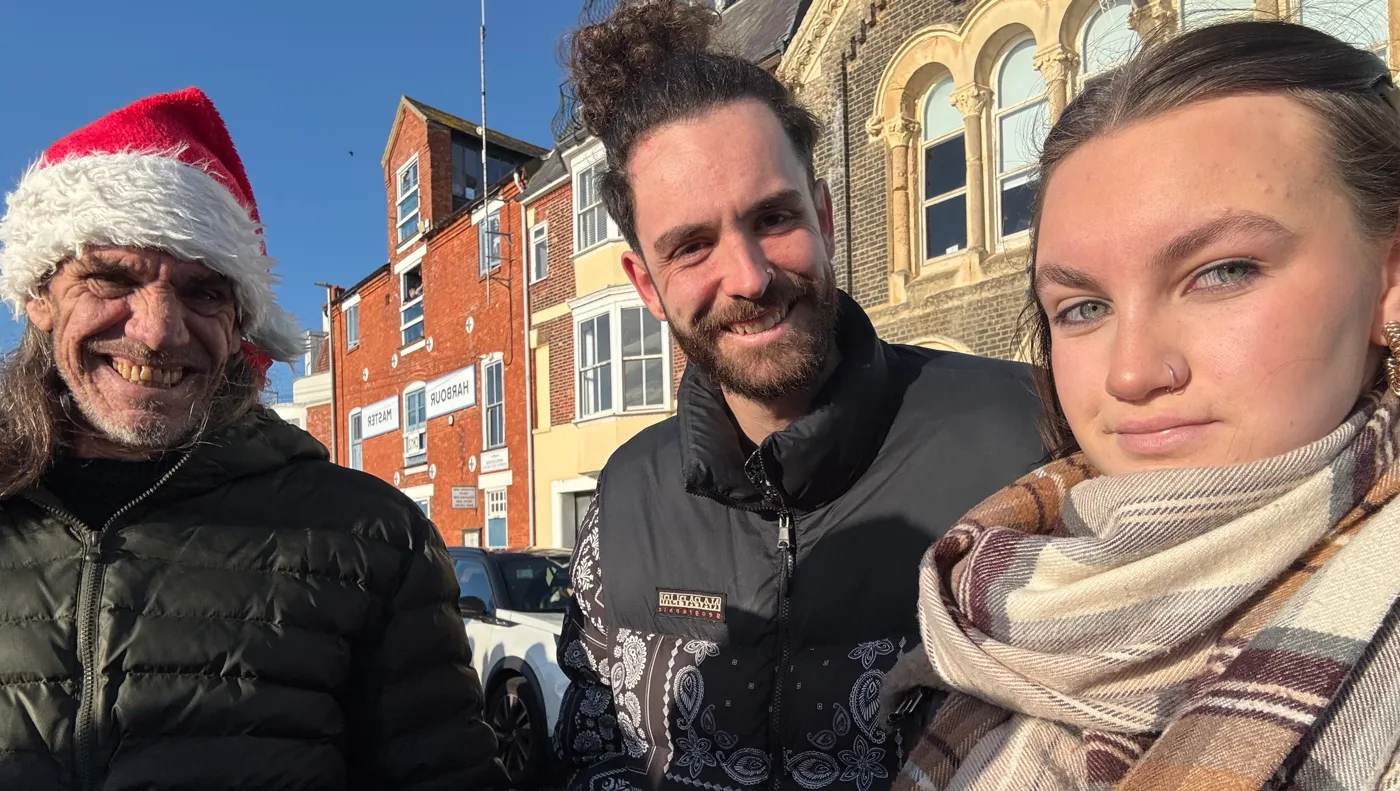 Ola Szwan, her partner Craig and his father together outside in Weymouth